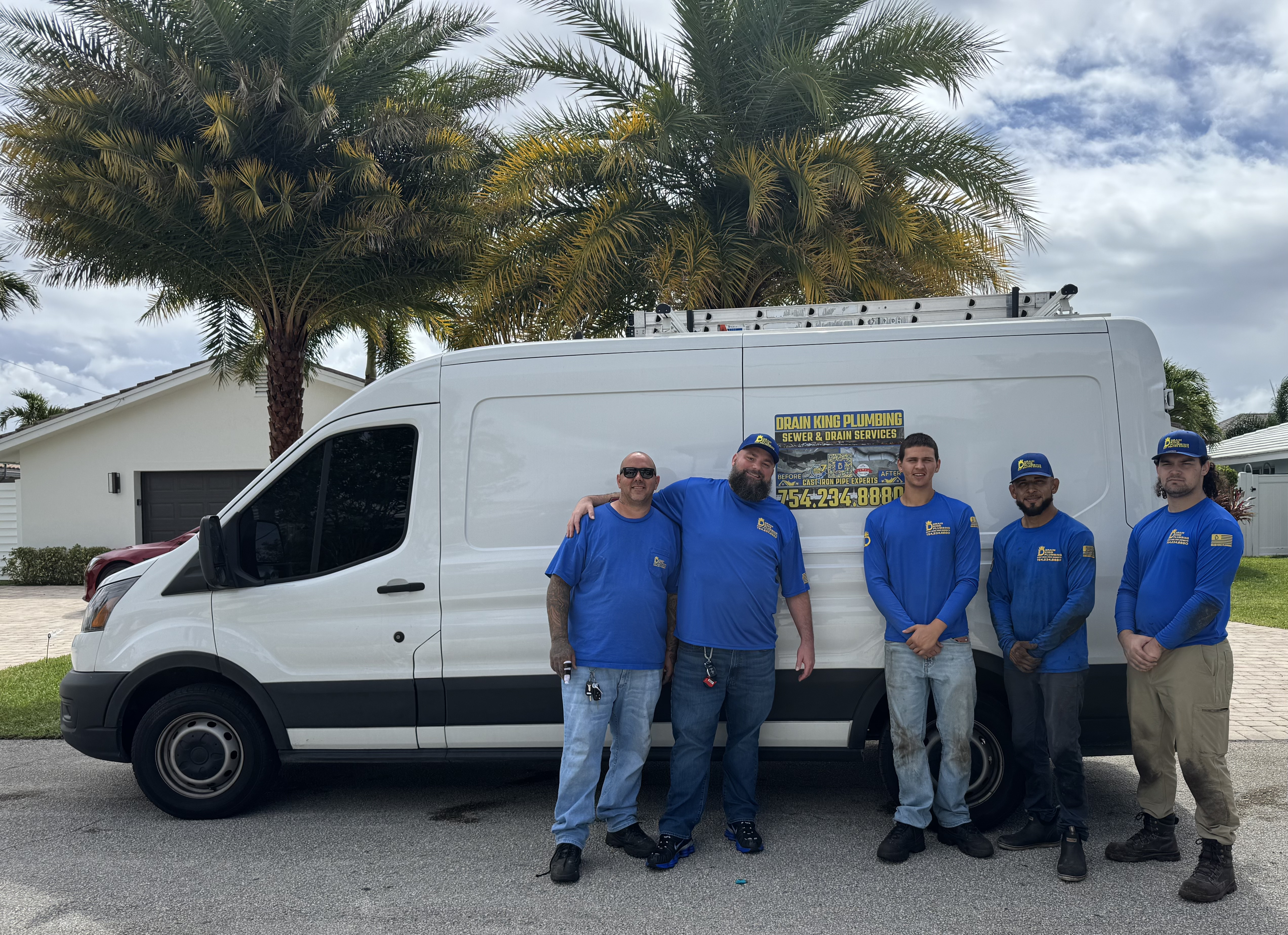 DRAIN KING PLUMBING team with service van — licensed local plumbers for South Florida homes
